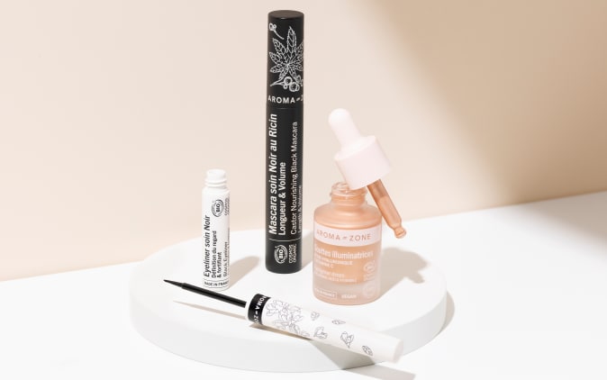 Aroma-zone eyeliner, mascara, and illuminating drops in a studio setting
