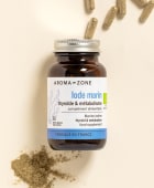 Complément alimentaire Iode Marin Aroma-Zone sur fond beige avec des gélules et de la poudre
